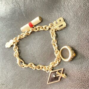 Gold Charm Bracelet with Red Accent